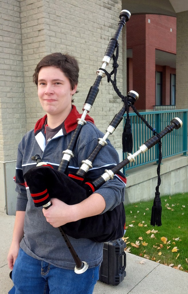 Dallas and her custom engraved thistle full silver Naill bagpipes. Over 10 lbs of sweet-sounding pipes -- they convinced me to pick up the pipes.